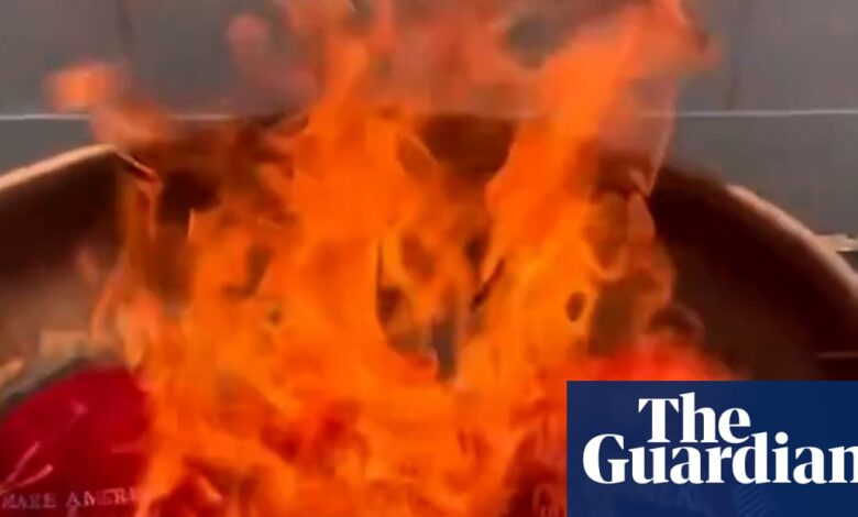 Trump supporters burn Maga hats after he dismisses Epstein files furor as ‘hoax’ | Jeffrey Epstein