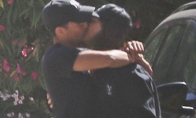 Two individuals embracing outdoors