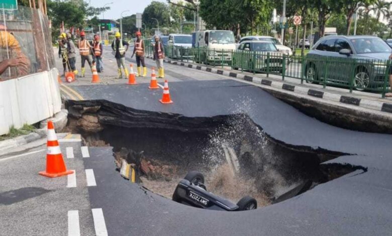 Woman taken to hospital after car falls into sinkhole on Tanjong Katong Road