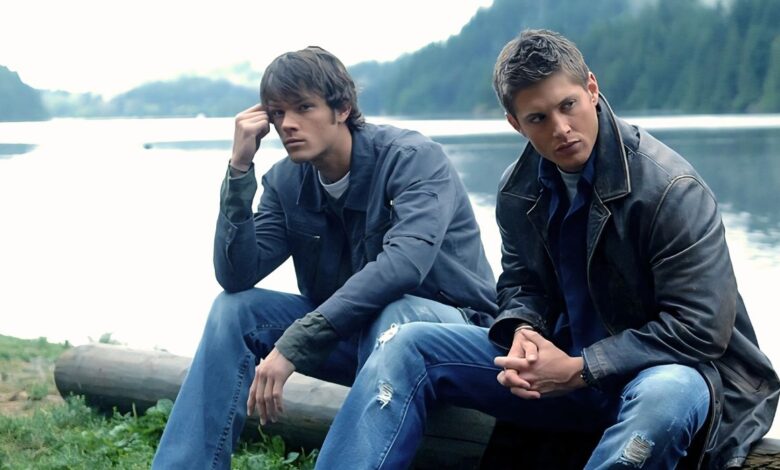 Jared Padalecki as Sam and Jensen Ackles as Dean sitting by the lake in the Supernatural episode