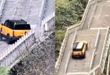 SUV híbrido da Chery tenta subir escadaria histórica na China, perde tração nos 999 degraus da Montanha Tianmen e danifica estrutura turística.